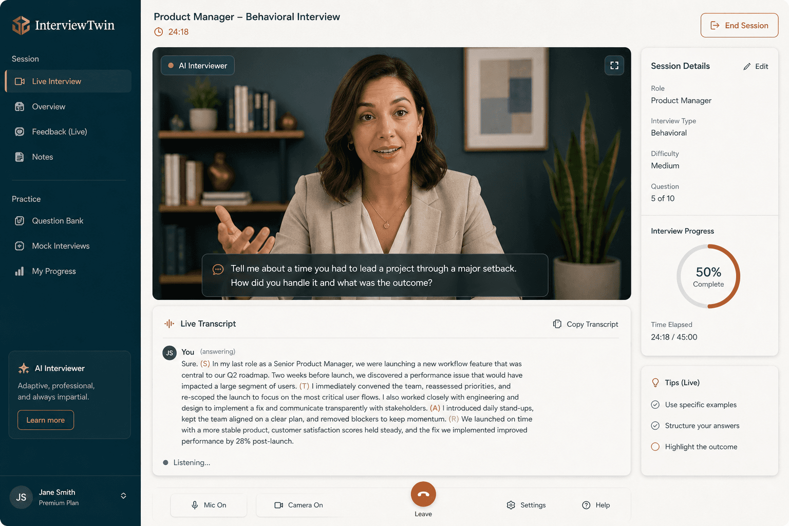 The InterviewTwin interface mid-session: an AI interviewer on camera asking a behavioral question, with a live transcript bubble of the candidate's STAR answer underneath.